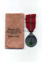 Ostmedaille mit Verleihungstüte, Hst. 30- "Hauptmünzamt Wien", Winterschlacht im Osten 1941/42