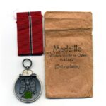 Ostmedaille mit Verleihungstüte, Hst. 110 – “Otto Zappe, Gablonz”, Winterschlacht im Osten 1941/42