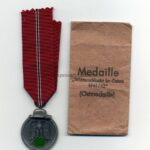 Ostmedaille mit Verleihungstüte, Hst. 20 (L/52!!), Winterschlacht im Osten 1941/42