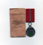 Ostmedaille mit Verleihungstüte, Hst. 6, Winterschlacht im Osten 1941/42