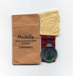 Ostmedaille, Winterschlacht im Osten 1941/42 (Hst. 66 – Friedrich Keller, Oberstein) mit Tüte