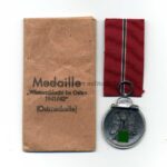 Ostmedaille mit Verleihungstüte, Hst. 65, Winterschlacht im Osten 1941/42