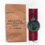 Ostmedaille mit Verleihungstüte, Hst. 20, Winterschlacht im Osten 1941/42