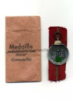 Ostmedaille mit Verleihungstüte, Hst. 65, Winterschlacht im Osten 1941/42